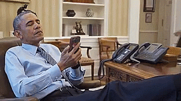 michelle takes barrack phone.gif